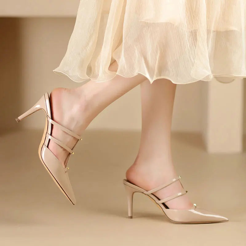 Hoge hakken spitse slippers 2026 lente en zomer nieuwe stijl lederen bovenwerk spitse metalen rivet lage instap damesschoenen